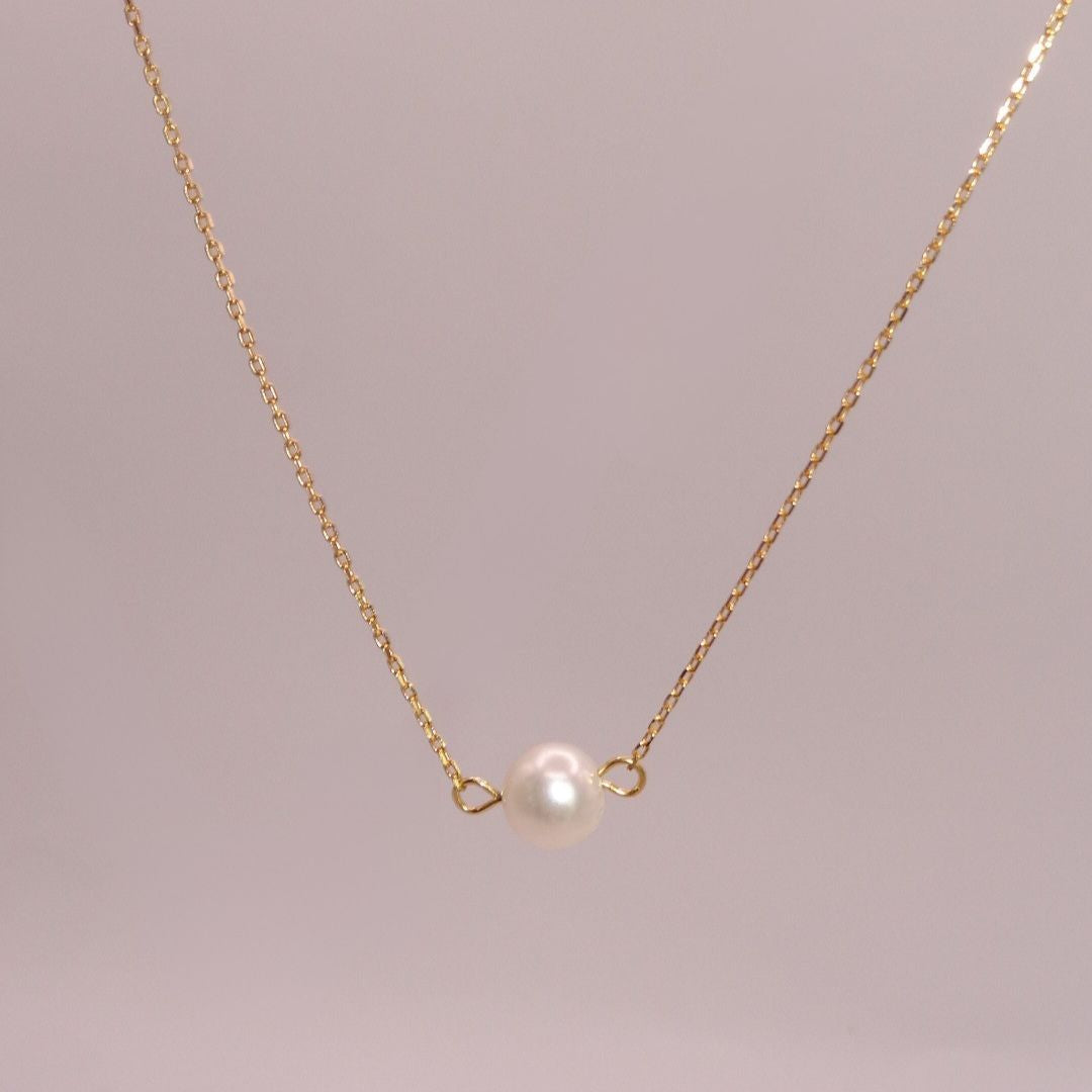 Collar de perla en chapa de oro