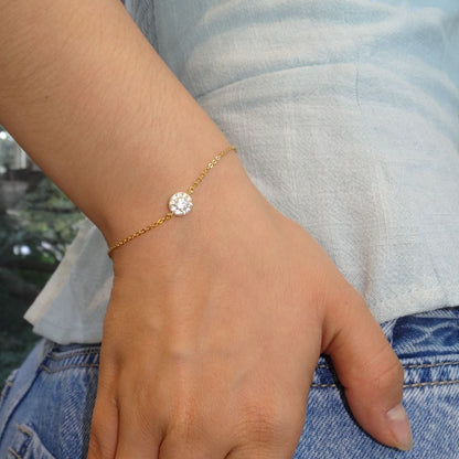 Pulsera dorada delgadita con bola con zirconias