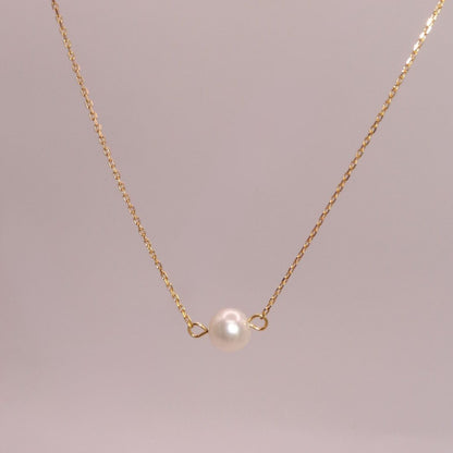 Collar de perla en chapa de oro